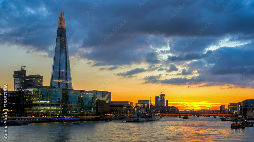 Business district with famous skyscrapers and landmarks at golden hour, London, UK