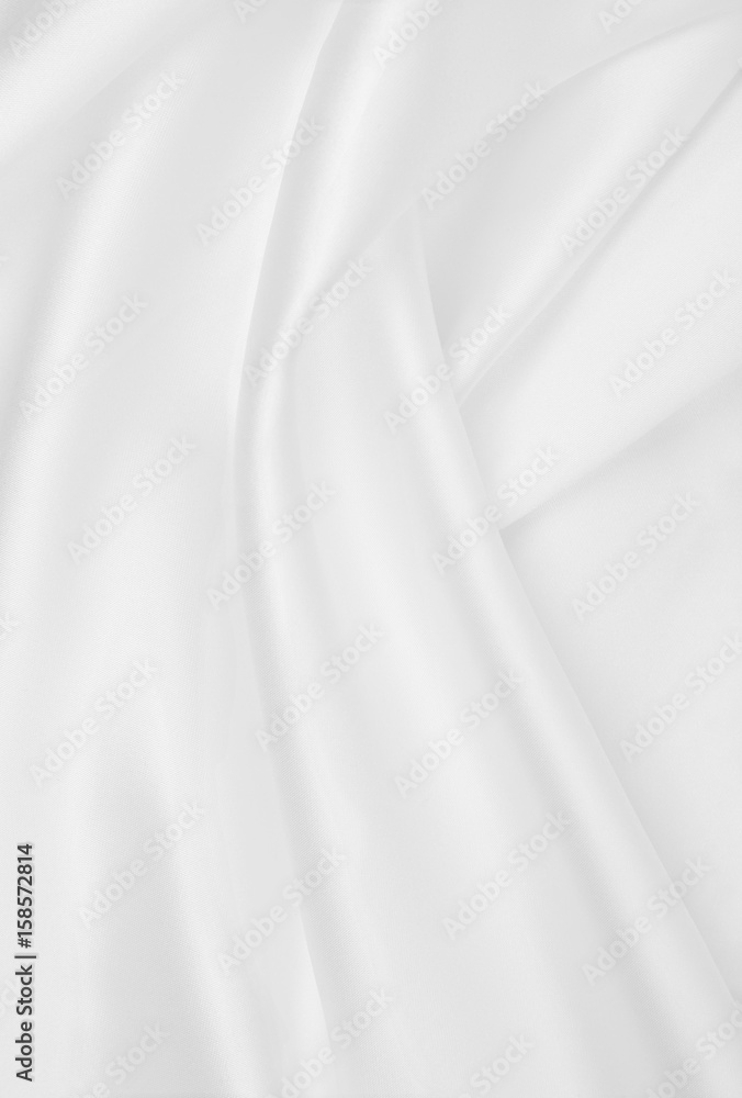 Smooth elegant white silk or satin luxury cloth texture as wedding background. Luxurious background design Smooth elegant white silk or satin luxury cloth texture as wedding background. Luxurious background design