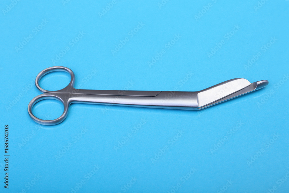 Close Up Surgical instruments and tools on blue mirror background. Selective focus. Close Up Surgical instruments and tools on blue mirror background. Selective focus.