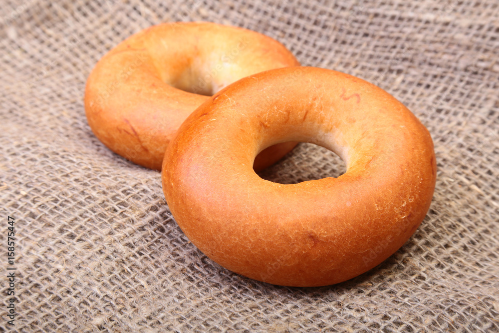 Fresh authentic New York style bagel isolated on Canvas cloth background Fresh authentic New York style bagel isolated on Canvas cloth background
