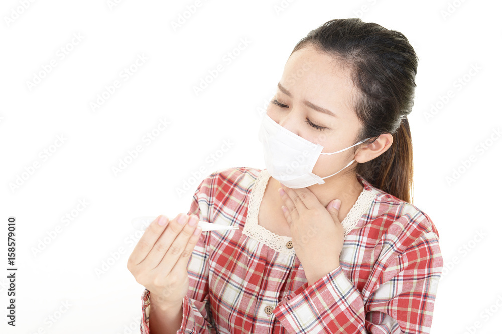 体調不良の女性