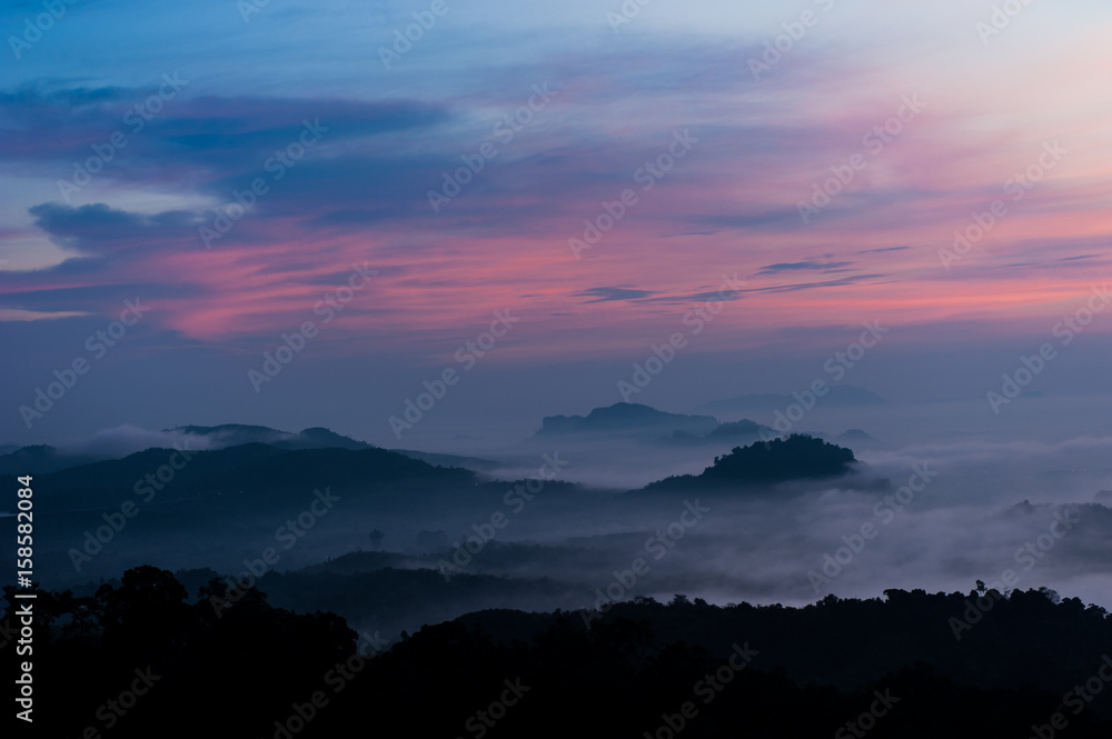 Fototapeta premium Mountain Mist,Beautiful landscape in the mountains at sunrise,Thailand