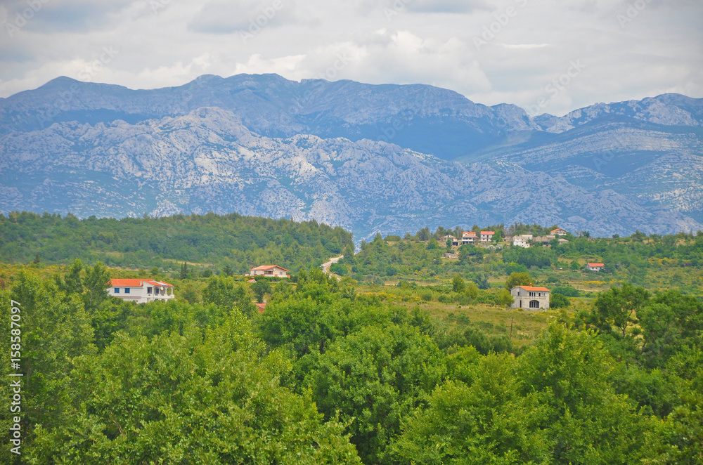 The cozy villages of Croatia mountains in the background