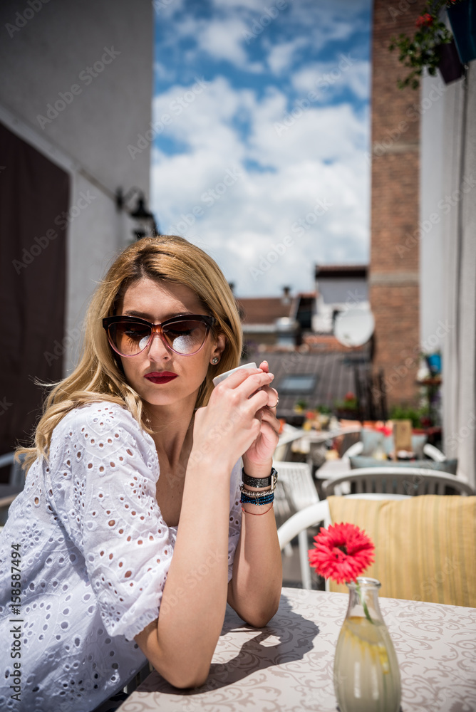 Fototapeta premium young woman enjoying in coffee 