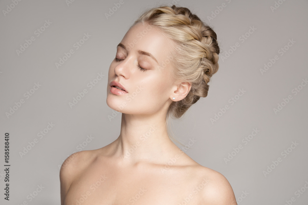 Portrait Of A Beautiful Young Blond Woman With Braid Crown Hairstyle. Portrait Of A Beautiful Young Blond Woman With Braid Crown Hairstyle.
