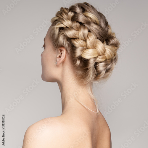Portrait Of A Beautiful Young Blond Woman With Braid Crown Hairstyle.