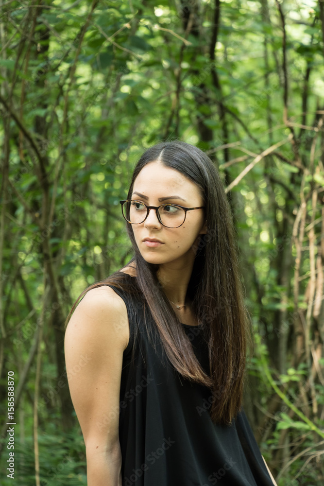 Young woman in evening dress in the woods Young woman in evening dress in the woods