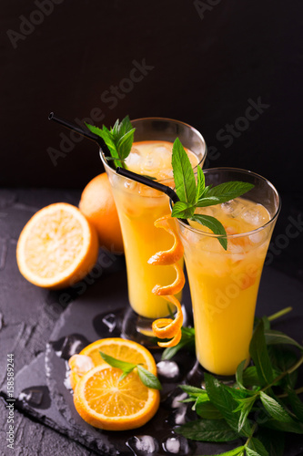 Aperitif with vodka, orange juice and mint. Screwdriver cocktail