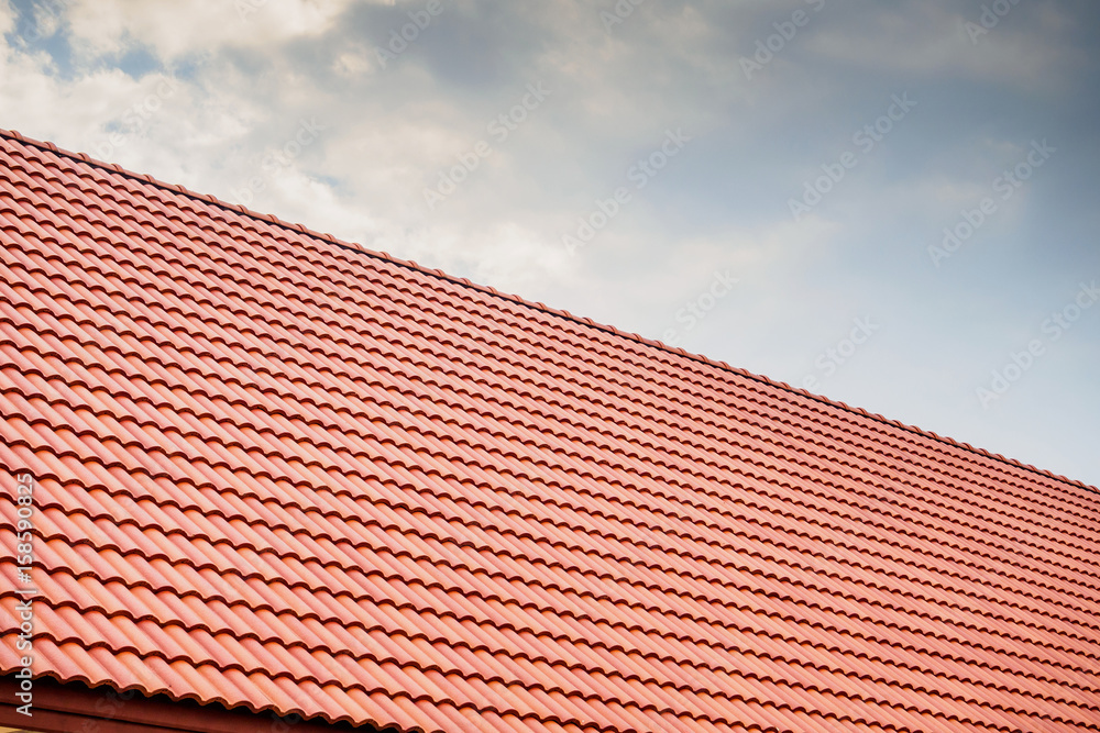 house roof tiles with clouds and sky