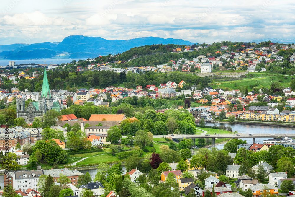 Summer in the norwegian city Trondheim. Aerial view of the river Nidelva , the Cathedral Nidarosdomen , Trondheim fjord and center of the city.