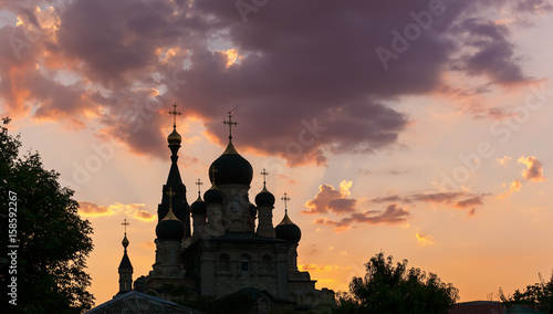 silhouette of orthodoxy church at sunset photo