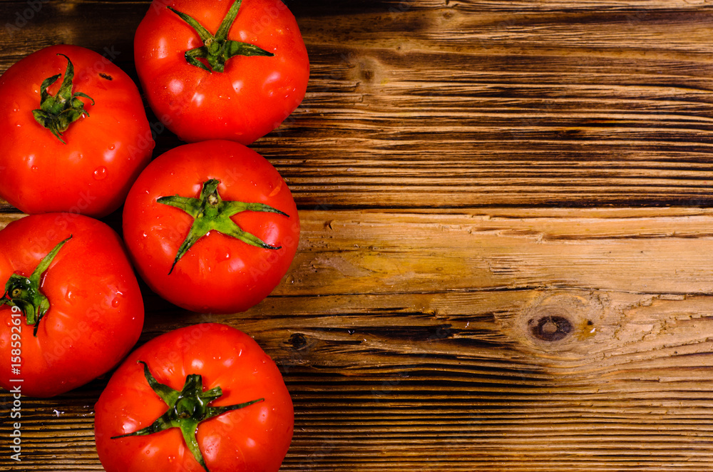 Ripe tomatoes on wooden table. Top view Ripe tomatoes on wooden table. Top view