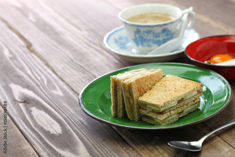 kaya jam toast with a cup of white coffee, singaporean malaysian breakfast kaya jam toast with a cup of white coffee, singaporean malaysian breakfast