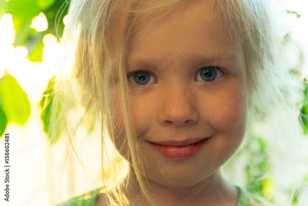 A smile of a young blond girl A smile of a young blond girl
