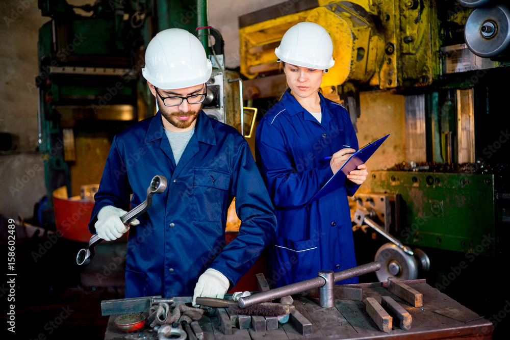 Workers with lathe Workers with lathe