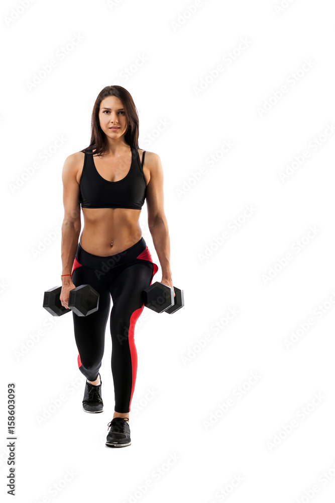 A sporty woman does the lunging of the legs with a dumbbell, legs in a half-position, hands along the torso on a white isolated background