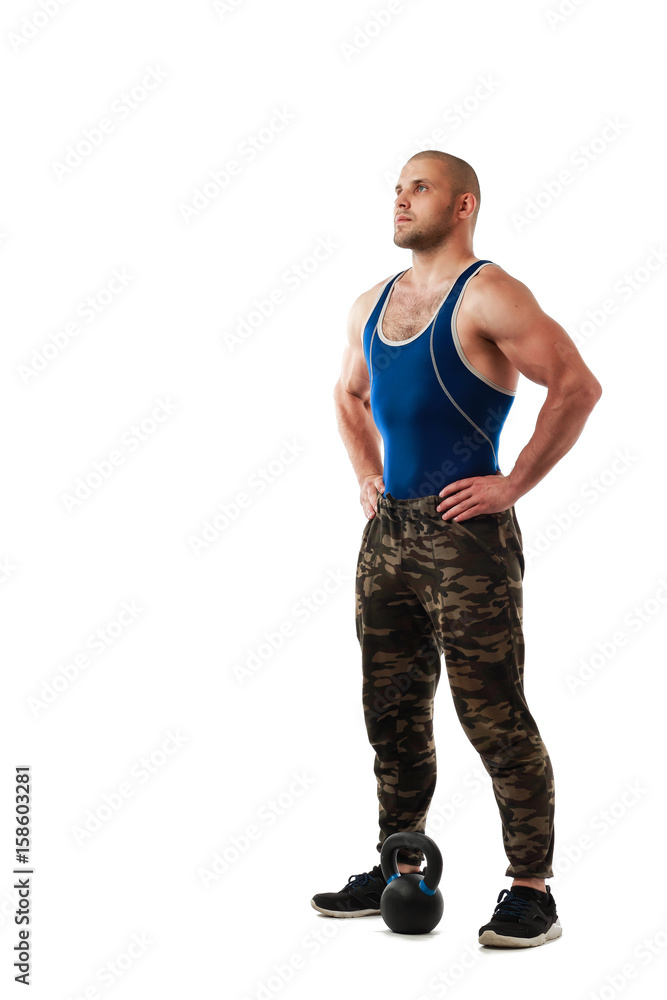 Young sporty man in sportswear posing on white isolated background, hands on sides Young sporty man in sportswear posing on white isolated background, hands on sides