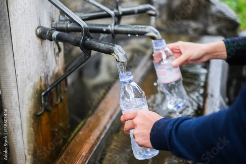 close up pf running water from fountain in Swiss - mineral water