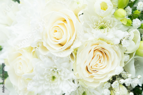 white fresh roses, freesia and mum flowers wediing bouquet close up © neirfy