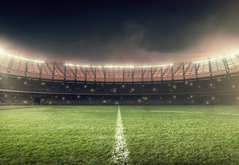 Rideaux Stade soccer stadium with green grass and illumination lights at night  © TandemBranding