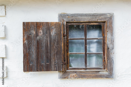 National Museum Pirogovo in the outdoors near Kiev. An old antique window in a vintage peasant white house in Ukraine.