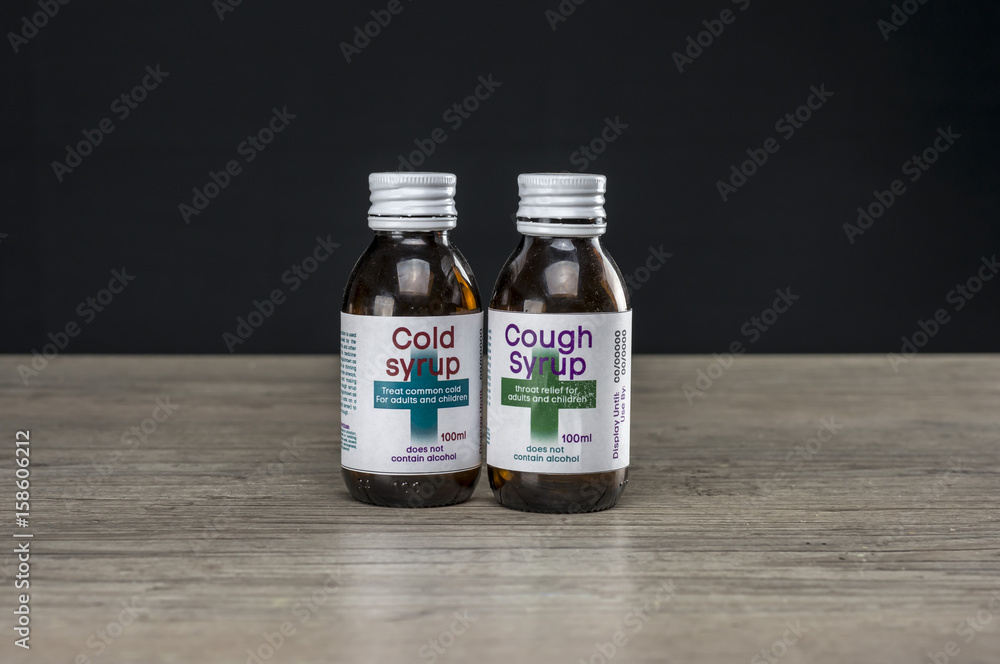 Close up shot of two bottles of medicine Close up shot of two bottles of medicine