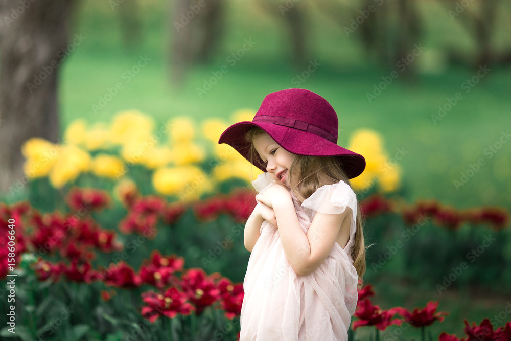 Beautiful girl in a burgundy hat