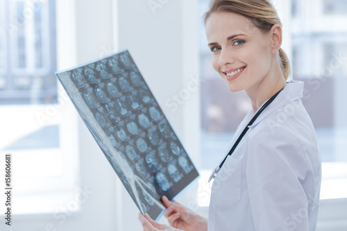Charming x ray specialist examining roentgen results at the laboratory