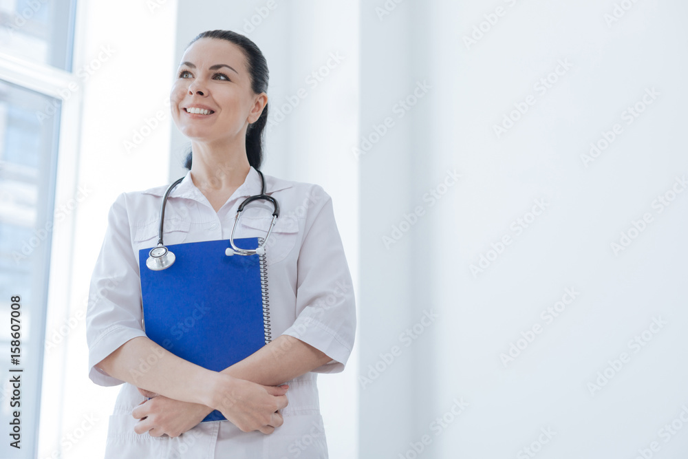 Inspired physician enjoying working responsibilities at the clinic