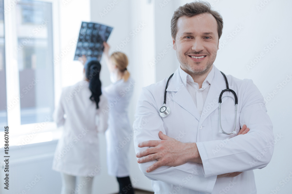 Confident neurosurgeon expressing positivity in the clinic Confident neurosurgeon expressing positivity in the clinic