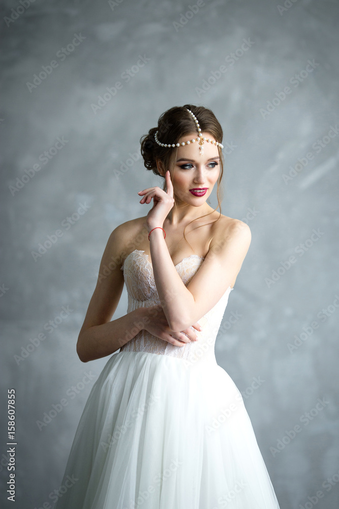 Portrait of a beautiful bride. Bride's fees in the studio Portrait of a beautiful bride. Bride's fees in the studio