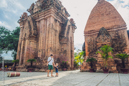 Father and Toddler Son tourists in Vietnam. Po Nagar Cham Tovers. Asia Travel concept. photo