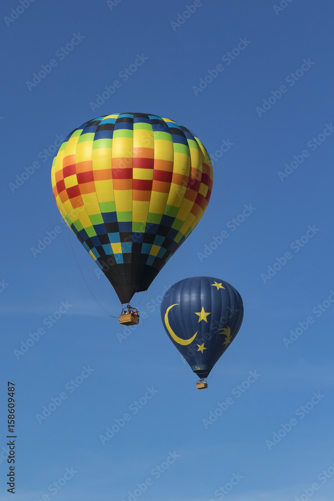 Fototapeta premium Balloons float above winery at Temecula Balloon Festival in Southern California