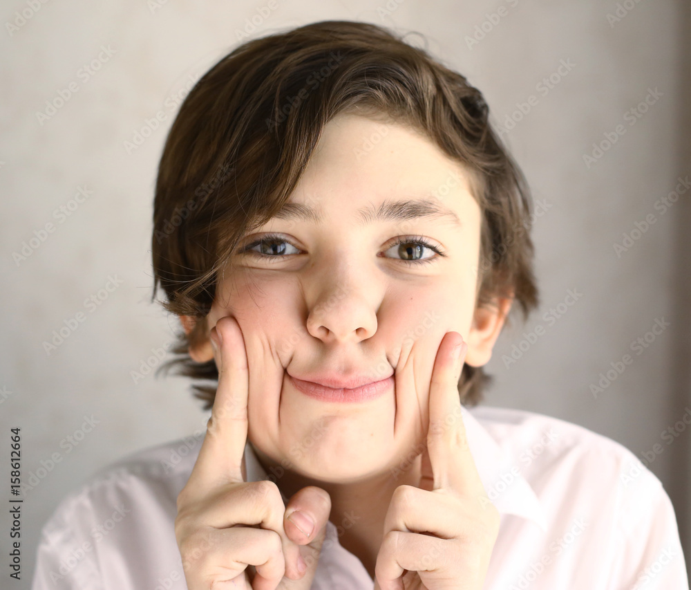 teenager boy mischievous grimacing close up portrait teenager boy mischievous grimacing close up portrait