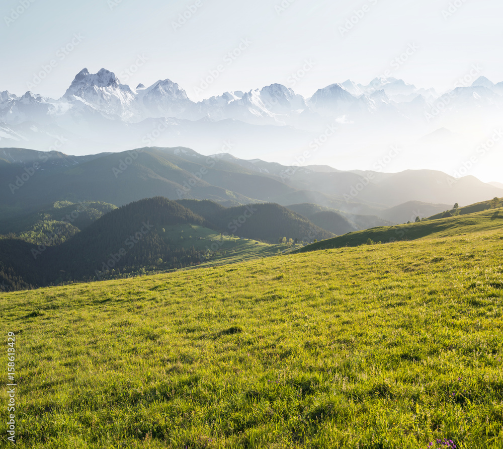 Mountain pasture abd clear sky. Beautiful natural landscape in the summer time