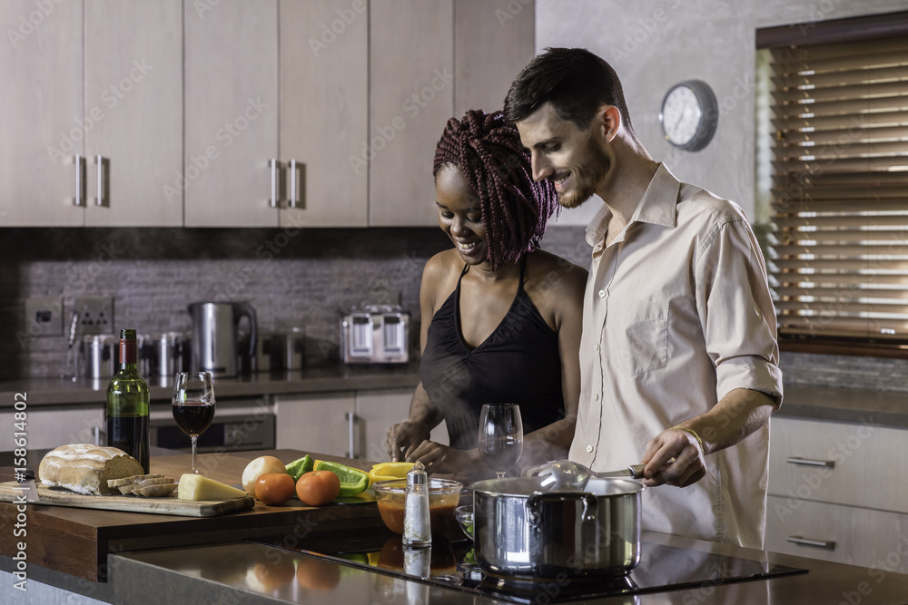 dinner preparation kitchen cooking happy young mixed race couple dinner preparation kitchen cooking happy young mixed race couple