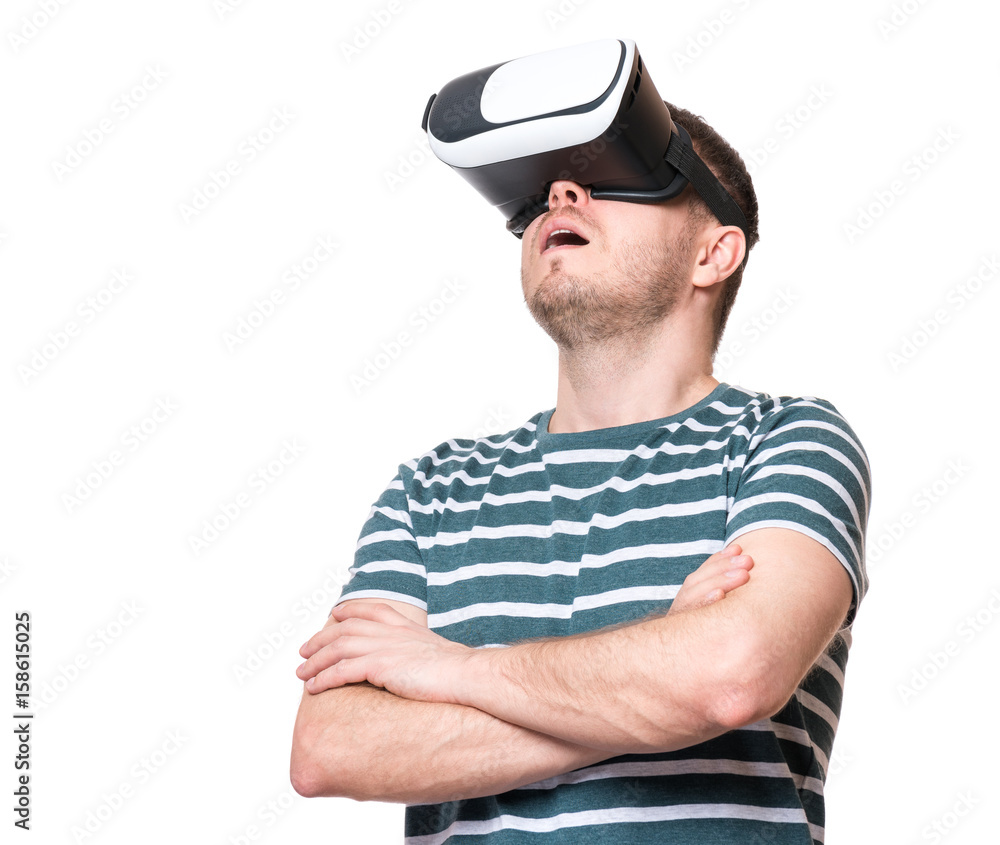 Amazed man wearing virtual reality goggles watching movies or playing video  games, isolated on white background. Surprised male in VR glasses. People  experiencing 3D technology. Stock Photo | Adobe Stock