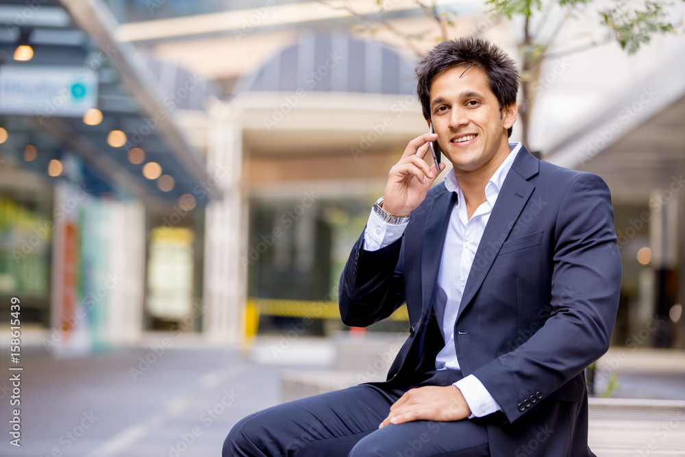 Portrait of confident businessman with mobile phone outdoors Portrait of confident businessman with mobile phone outdoors