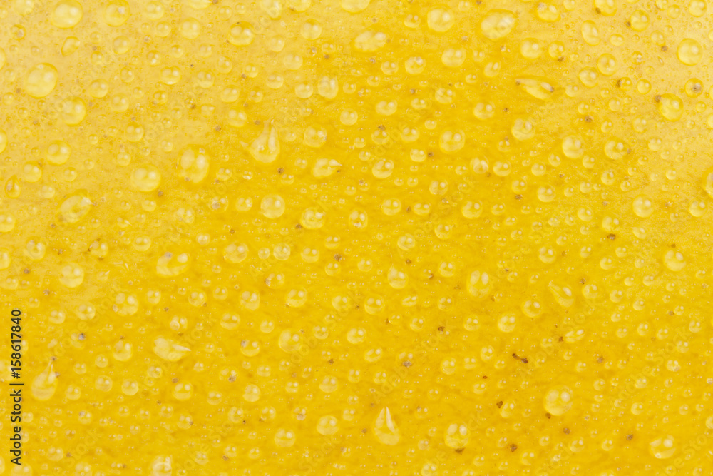 Fresh mango with water dew, texture background Fresh mango with water dew, texture background