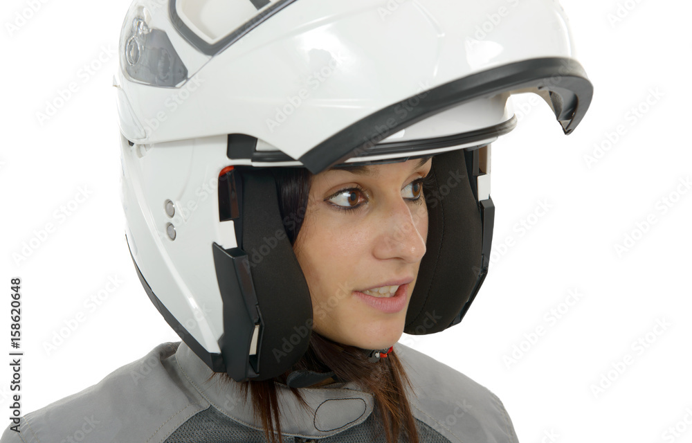 Beautiful biker woman with a helmet isolated on white Beautiful biker woman with a helmet isolated on white
