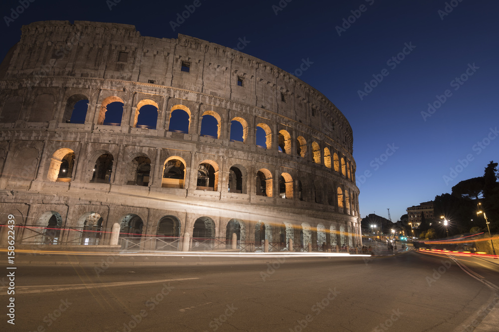 Light trails at Colosseum in Rome at dusk, Italy