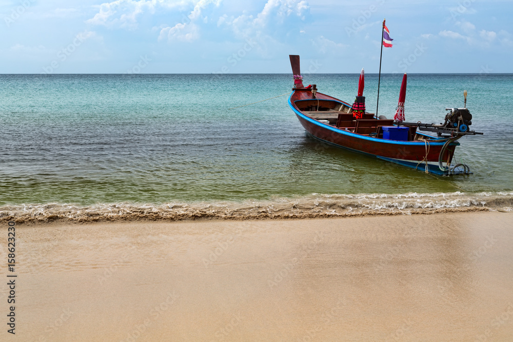 Thai traditional boat on the beach on the roads Thai traditional boat on the beach on the roads