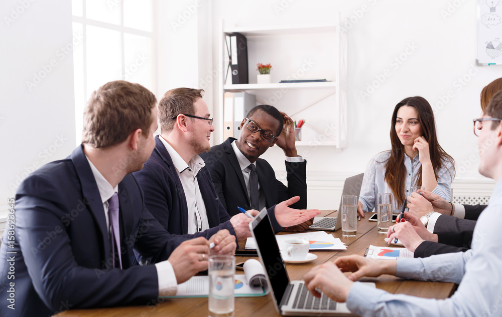 Business meeting. Young team in modern office Business meeting. Young team in modern office