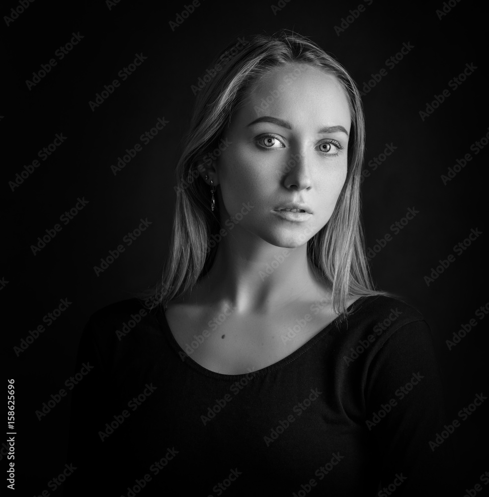 Black and white portrait of a beautiful young woman. Black and white portrait of a beautiful young woman.
