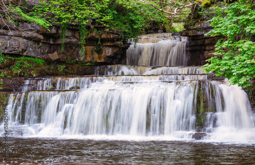 Fototapeta Naklejka Na Ścianę i Meble -  Cotter Force Waterfall / Cotter Force is a small waterfall on Cotterdale Beck, a minor tributary of the River Ure, near the mouth of Cotterdale, a side dale in Wensleydale, North Yorkshire