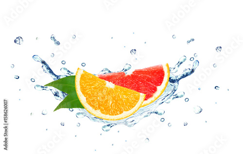 Grapefruit and orange splash water isolated on a white background