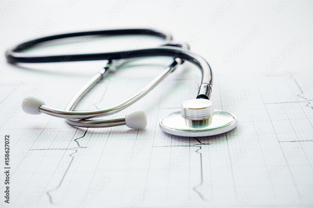 Medical concept image. stethoscope on the cardiogram.Stethoscope seen from above. A lot copy space around the product. Top view. Horizontal image. Medical concept image. stethoscope on the cardiogram.Stethoscope seen from above. A lot copy space around the product. Top view. Horizontal image.