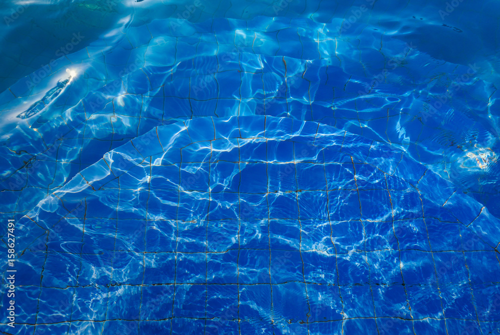water in swiming pool with sun reflections use for background water in swiming pool with sun reflections use for background