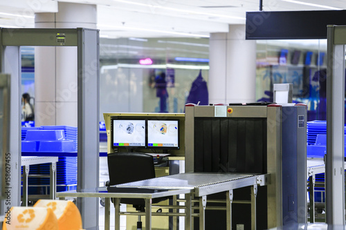 Checkpoint in Airport security with metal detector and X ray scanner