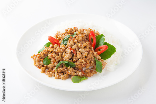 stir-fried with minced pork and basil on white plate (Ka Prao Moo)